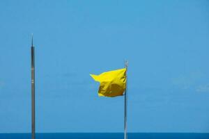 Coloured flags indicating danger and safety photo