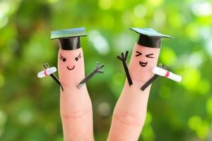 Finger art of friends. Group of students holding their diploma after graduation photo