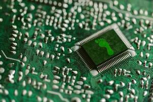 Environment green technology computer chip. Green world icon on circuit board technology innovations. Concept of green technology. Green Computing, Green Technology, Green IT, CSR, and IT ethics. photo