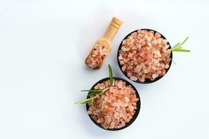 Himalayan pink salt is herb seasoning from himalaya and isolated on white background with copy space photo