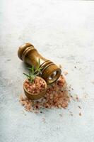 Himalayan pink salt is herb seasoning from himalaya and isolated on white abstract background with copy space photo