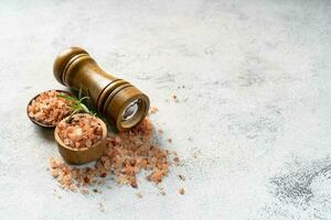 Himalayan pink salt is herb seasoning from himalaya and isolated on white abstract background with copy space photo