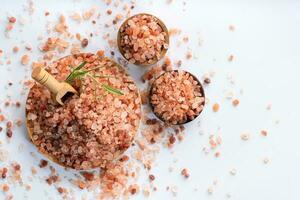 Himalayan pink salt is herb seasoning from himalaya and isolated on white background with copy space photo