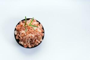 Himalayan pink salt is herb seasoning from himalaya and isolated on white background with copy space photo