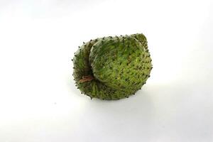 Raw Soursop on white background. photo