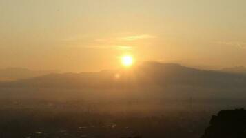 The sun rises over the mountains photo