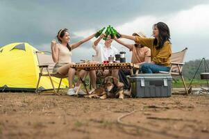 Group of young  Asian people are enjoy camping in natural campsite photo