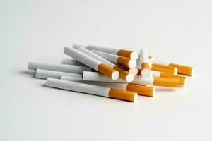 Many cigarettes on white background with copy space. The drug is harmful to the respiratory system. photo