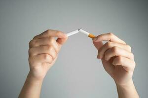 Stop smoking cigarettes concept. Quit bad habit, health care concept. No smoking. photo