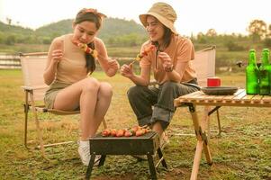 young pretty Asian woman  enjoy camping photo