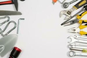 Set of tools for repair in a case on a white background. Assorted work or construction tools. Wrenches, Pliers, screwdriver. Top view photo