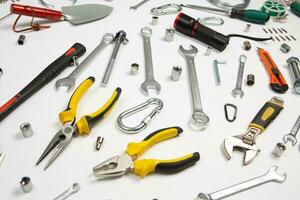 Set of tools for repair in a case on a white background. Assorted work or construction tools. Wrenches, Pliers, screwdriver. Top view photo