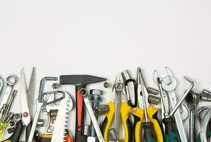 Set of tools for repair in a case on a white background. Assorted work or construction tools. Wrenches, Pliers, screwdriver. Top view photo