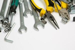 Set of tools for repair in a case on a white background. Assorted work or construction tools. Wrenches, Pliers, screwdriver. Top view photo