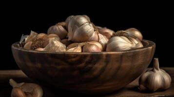 Garlic Cloves and Bulb in vintage wooden bowl, black baground, generative ai photo