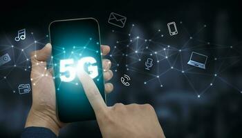 Hand hold mobile phone with technology 5G of mobile telecommunication network in Europe for high speed wireless data connection to internet from smartphones, future technology 5G network. photo