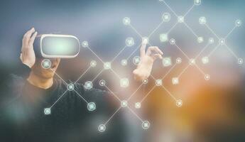 Businessman wearing virtual reality goggles VR and touch in graph Screen of a media screen on the dark background,Technology Process System Business, success and teamwork concept photo