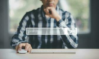 Searching Browsing Internet Data Information with blank search bar. man's hands are using a computer keyboard to Searching for information. Using Search Console with your website. photo