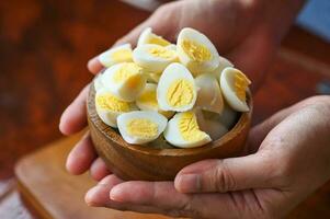 boiled eggs food, quail eggs on bowl, breakfast eggs with fresh quail eggs on hand served on the table food photo