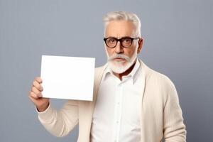 A man holds a blank white sign board mockup in his hand photo