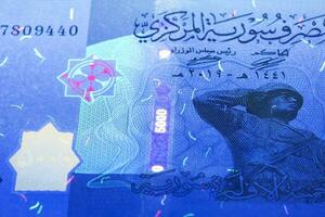 Syrian money in UV rays photo