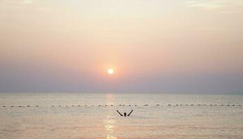 Life is good. Successful man enjoying life and freedom. Swimming enjoying nature. photo