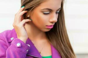 Close-up portrait of a beautiful young girl in a hot summer day. photo