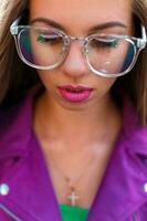 Female face with glasses closeup photo