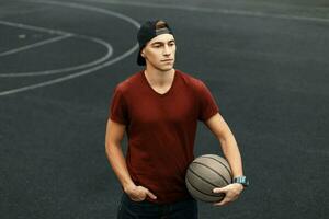 Handsome man with ball, outdoors photo