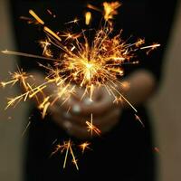 Amazing sparklers in female hands. photo