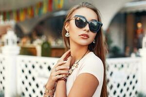 Fashionable beautiful woman in stylish sunglasses photo