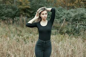 Beautiful sexy girl posing in the field. photo