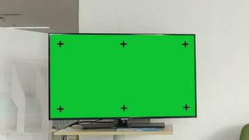 Television on desk with green screen for product display, Television mockup screen, Zoom in shot. video