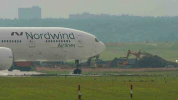 MOSCOW, RUSSIAN FEDERATION JULY 29, 2021 - Boeing 777 of Nordwind airlines taxis on the runway at Sheremetyevo airport, Moscow SVO. Airplane on the airfield. Tourism and travel concept. video