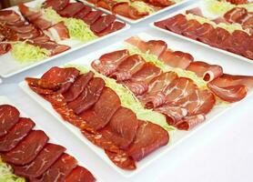 Mixed appetizers of pork meat photo