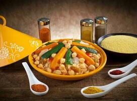 Vegetable tagine with cous cous and spices photo