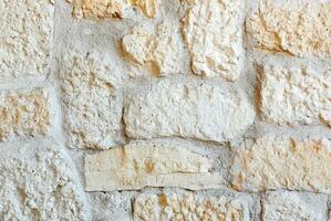 Wall lined with porphyry stones photo