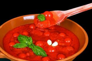 Bowl with tomato sauce photo