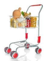 Shopping cart full with money box and food products photo