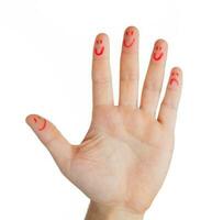 mano con dedos emoticonos, excepto uno dedo triste. foto