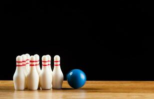 Bowling pins and bowling ball in miniature photo