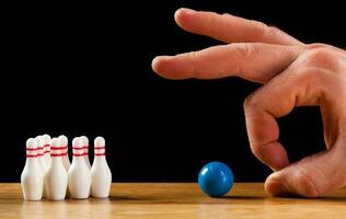 Bowling pins and bowling ball in miniature photo