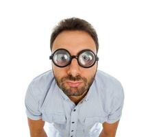 Man with a surprised expression and thick glasses photo