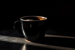 A black coffee mug is shown on a dark background with a shadow on the ground and a black background with a black coffee mug on it. photo