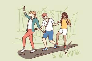 Group of friends participate in hike balancing on log thrown across river instead of bridge. Guy and two girls enjoy outdoor activities and hike in nature reserve with impenetrable terrain vector