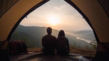 Man and Abundant woman couple appreciate in they tent at they camping point with morning to start with light see. Creative resource, photo