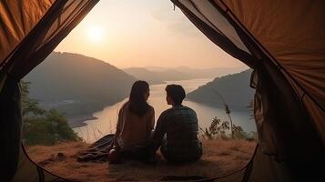 Man and Plenteous woman couple appreciate in they tent at they camping point with morning to start with light see. Creative resource, photo