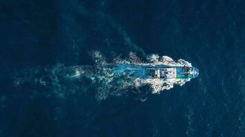 Top view of a fishing boat sailing in the Atlantic Ocean video