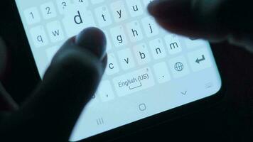 Hands typing text on smartphone close-up. Using smartphone close up at night. Communication concept video