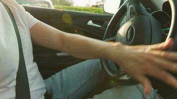 Man driving in innovative automated car using self-parking autopilot for parking on parking lot video